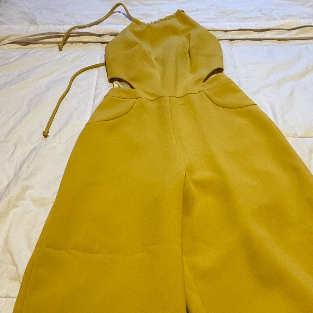 Jumpsuit greenish/yellowish. Size XS.